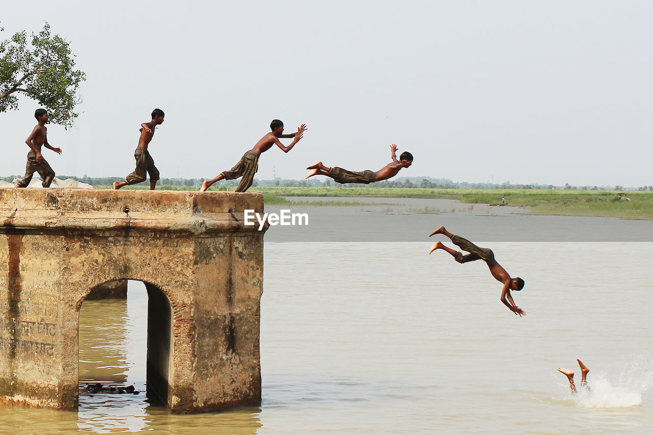 Child jumping in river