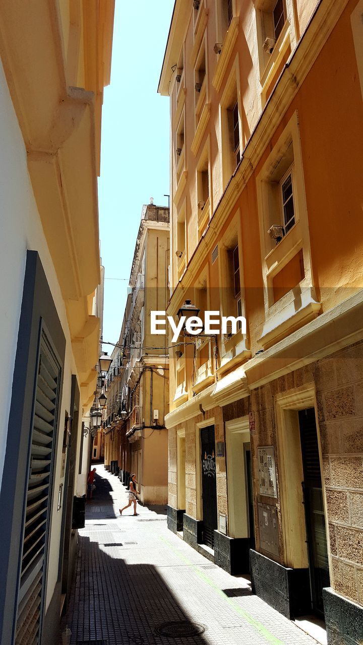 STREET AMIDST BUILDINGS IN CITY