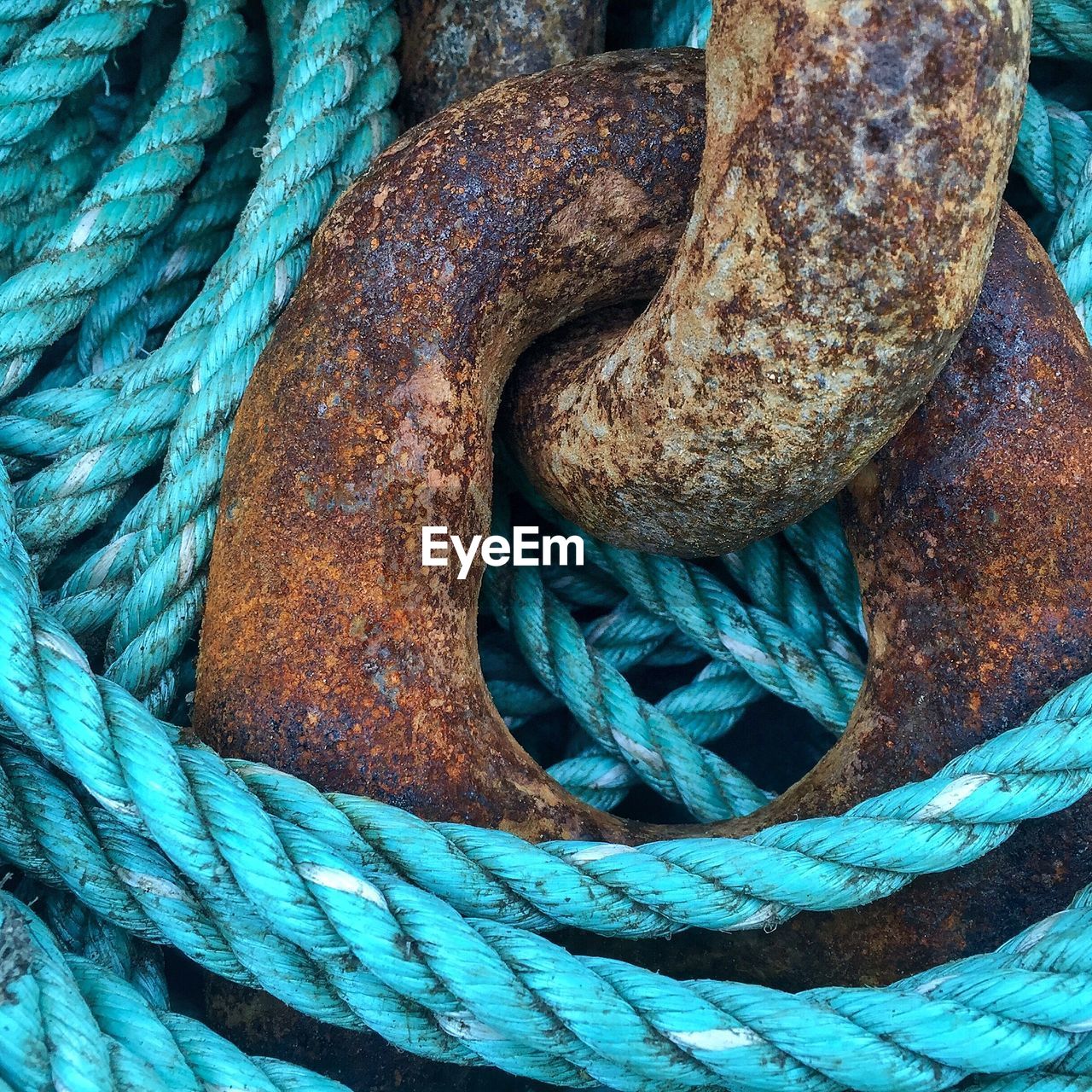 Close-up of rusty metal and rope