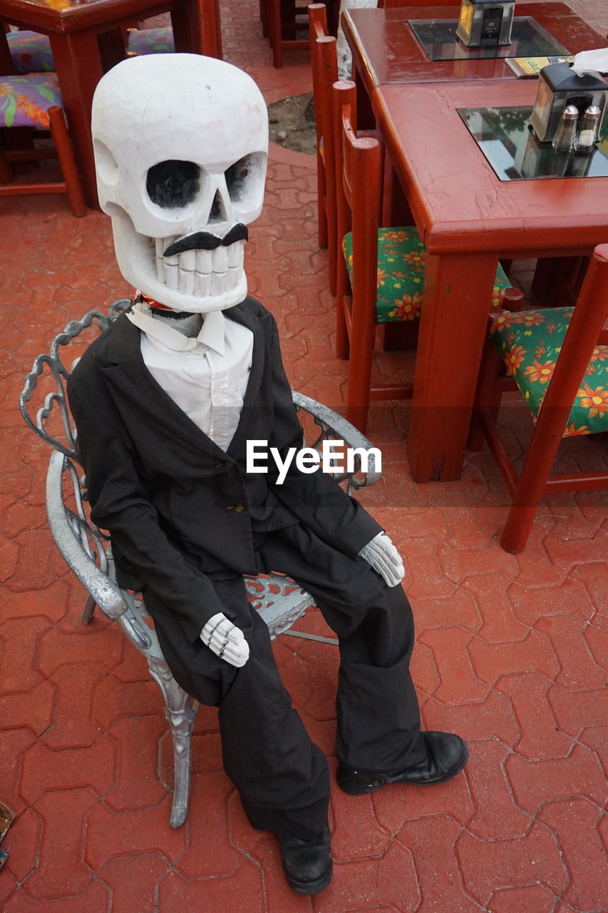High angle view of halloween decoration on chair at restaurant