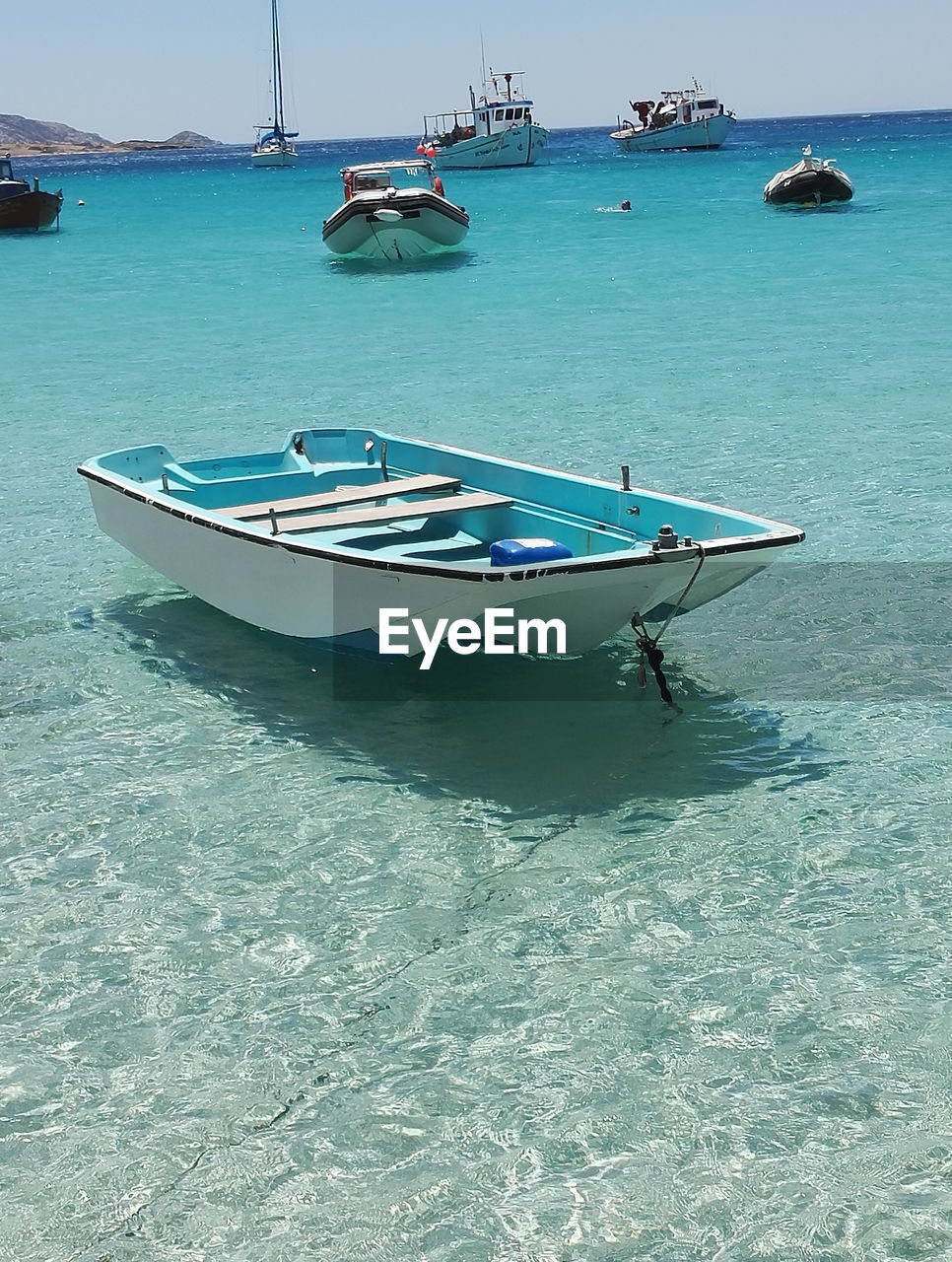 Boats moored on sea