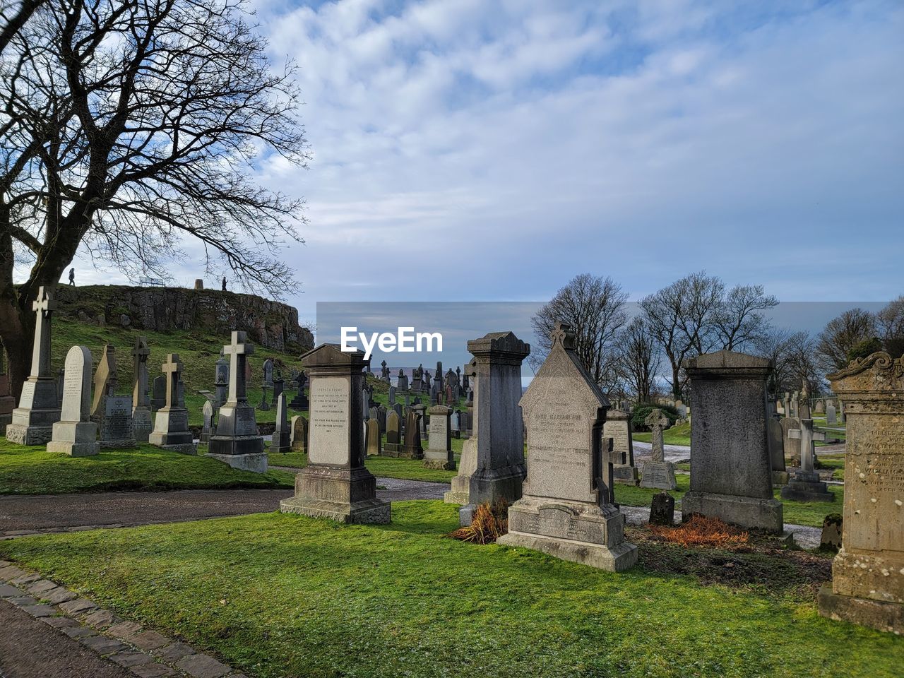 cemetery, grave, sky, plant, architecture, history, the past, cloud, death, tombstone, tree, nature, religion, stone, grass, memorial, stone material, no people, built structure, travel destinations, belief, ruins, spirituality, sadness, ancient, travel, outdoors, day, tourism, estate, place of worship, old ruin