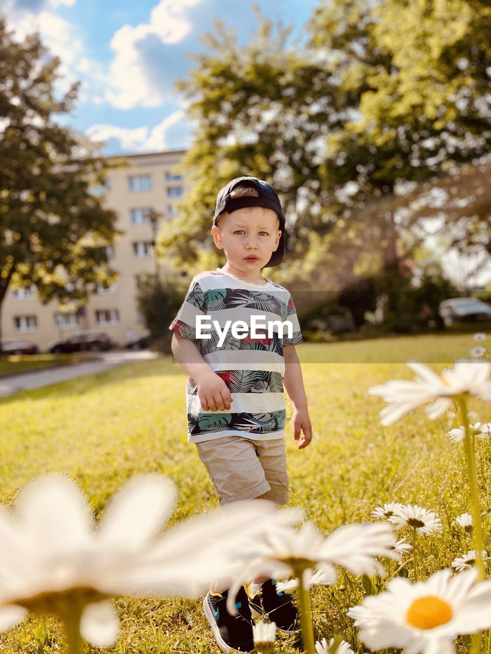 Full length of boy standing on field