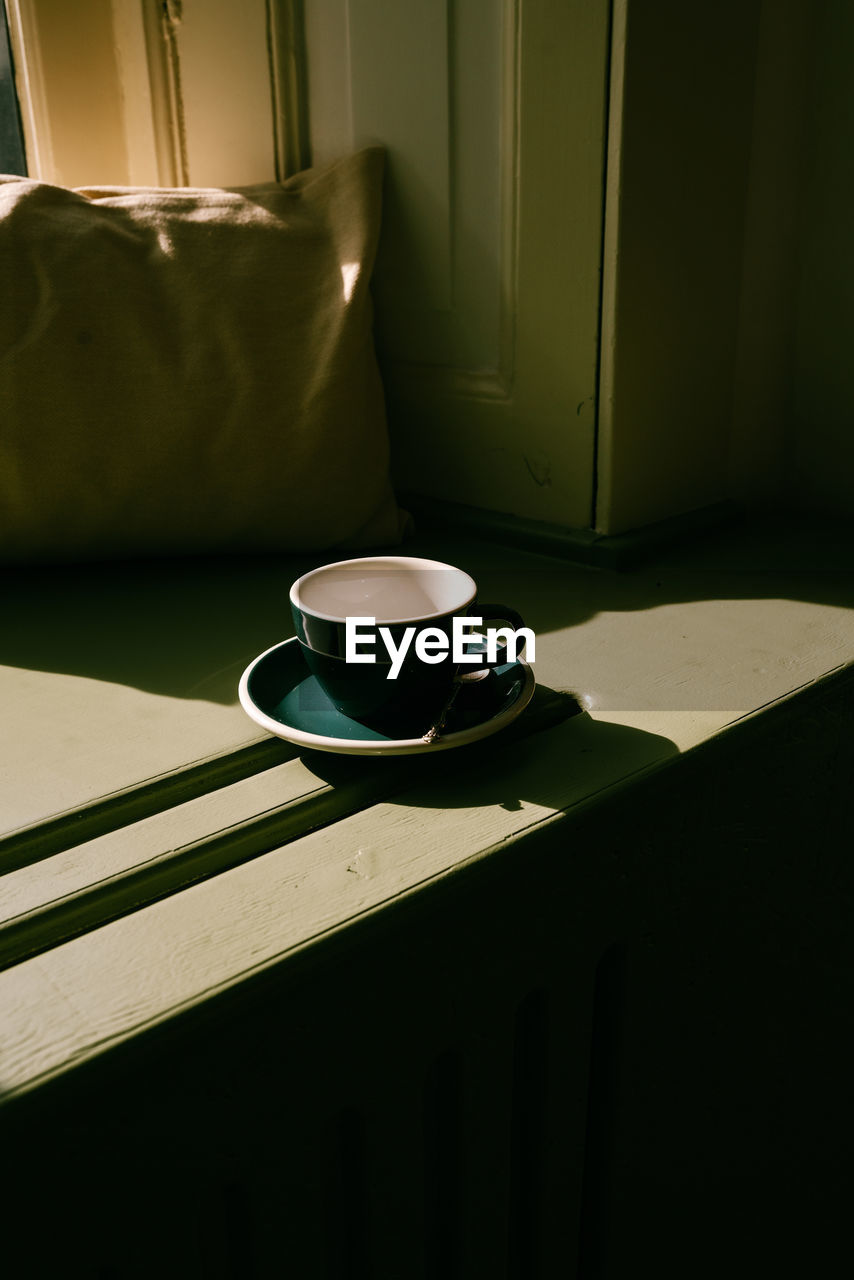 High angle view of coffee cup on table