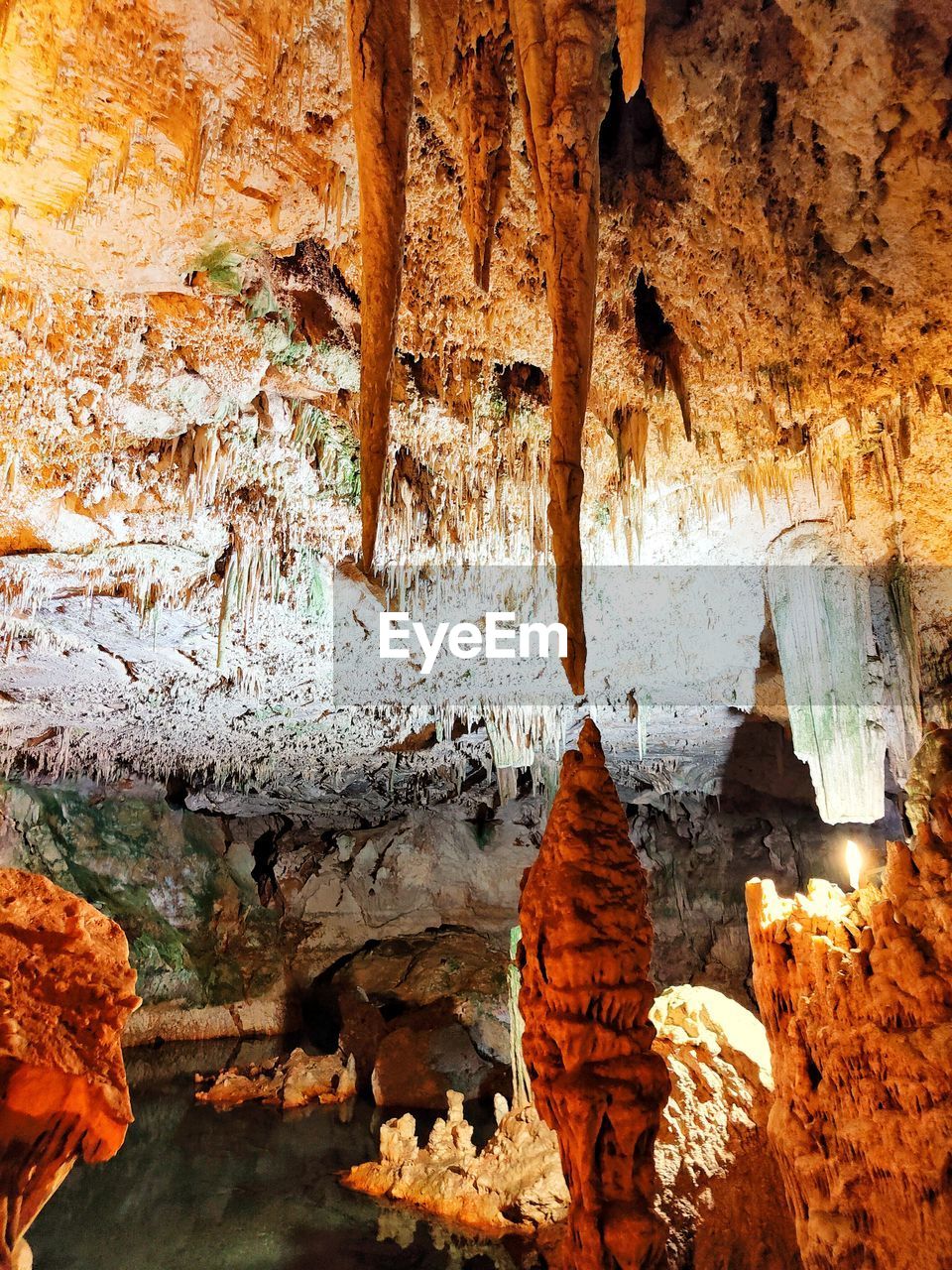 stalagmite, rock, rock formation, cave, geology, stalactite, no people, nature, physical geography, speleothem, formation, beauty in nature, non-urban scene, day, pattern, outdoors, caving, travel destinations, eroded, tranquility