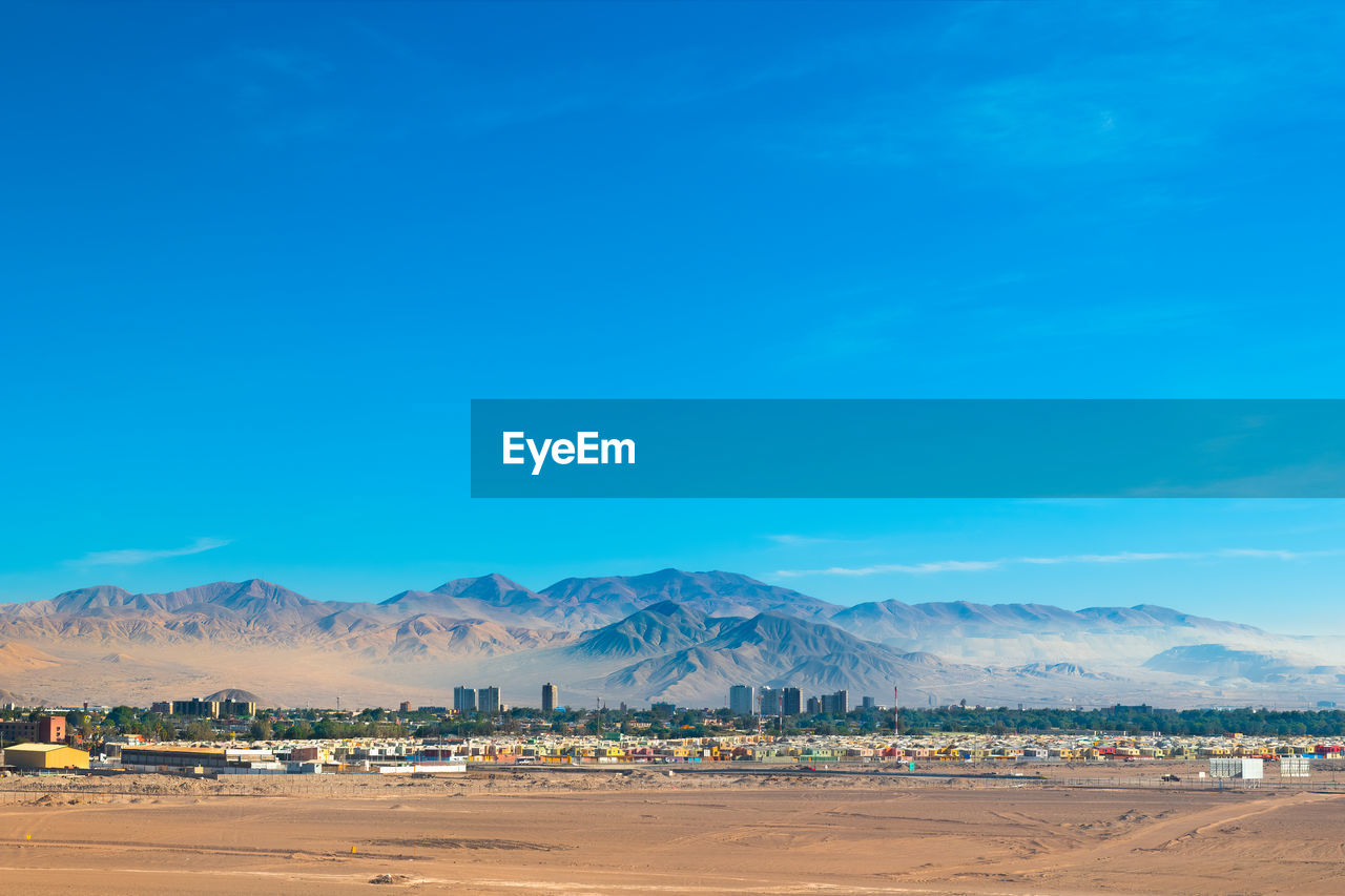 Aerial view of the mining city of calama in chile with chuquicamata copper mine in the back.