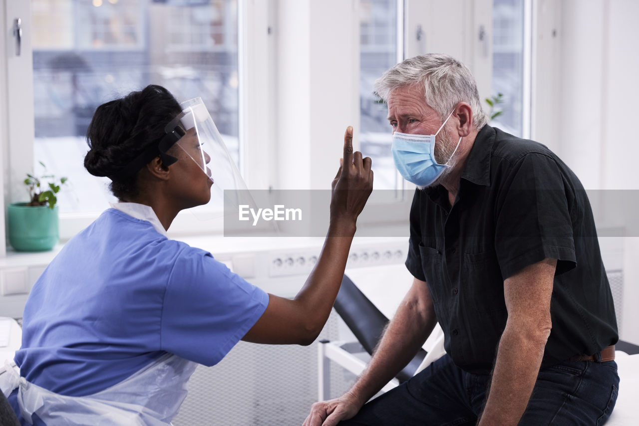 Senior man having eye exam during doctor appointment