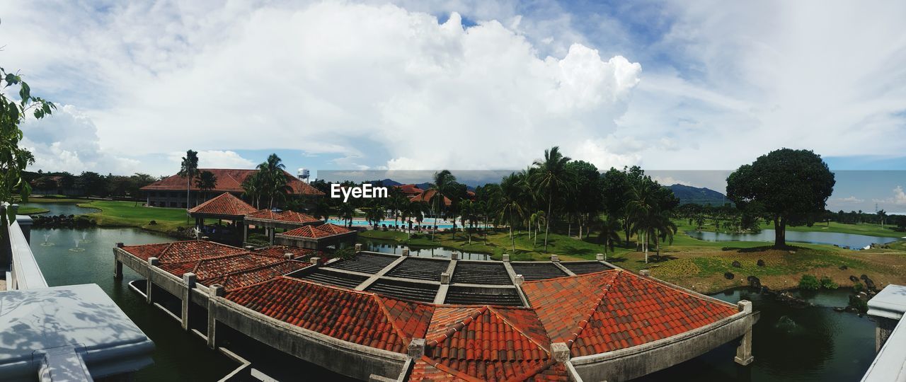 VIEW OF BUILT STRUCTURE AGAINST CLOUDY SKY