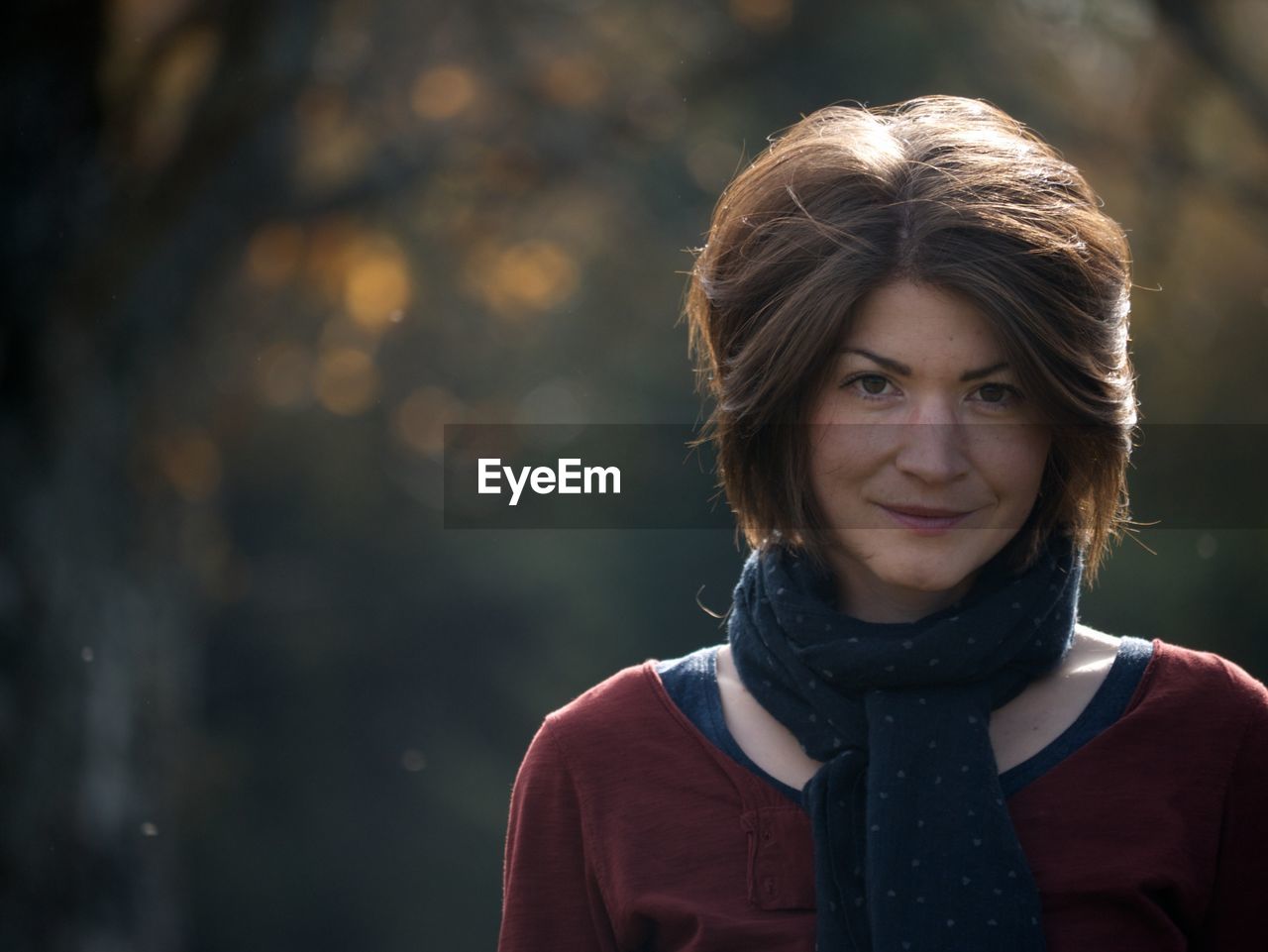 Portrait of smiling woman standing outdoors