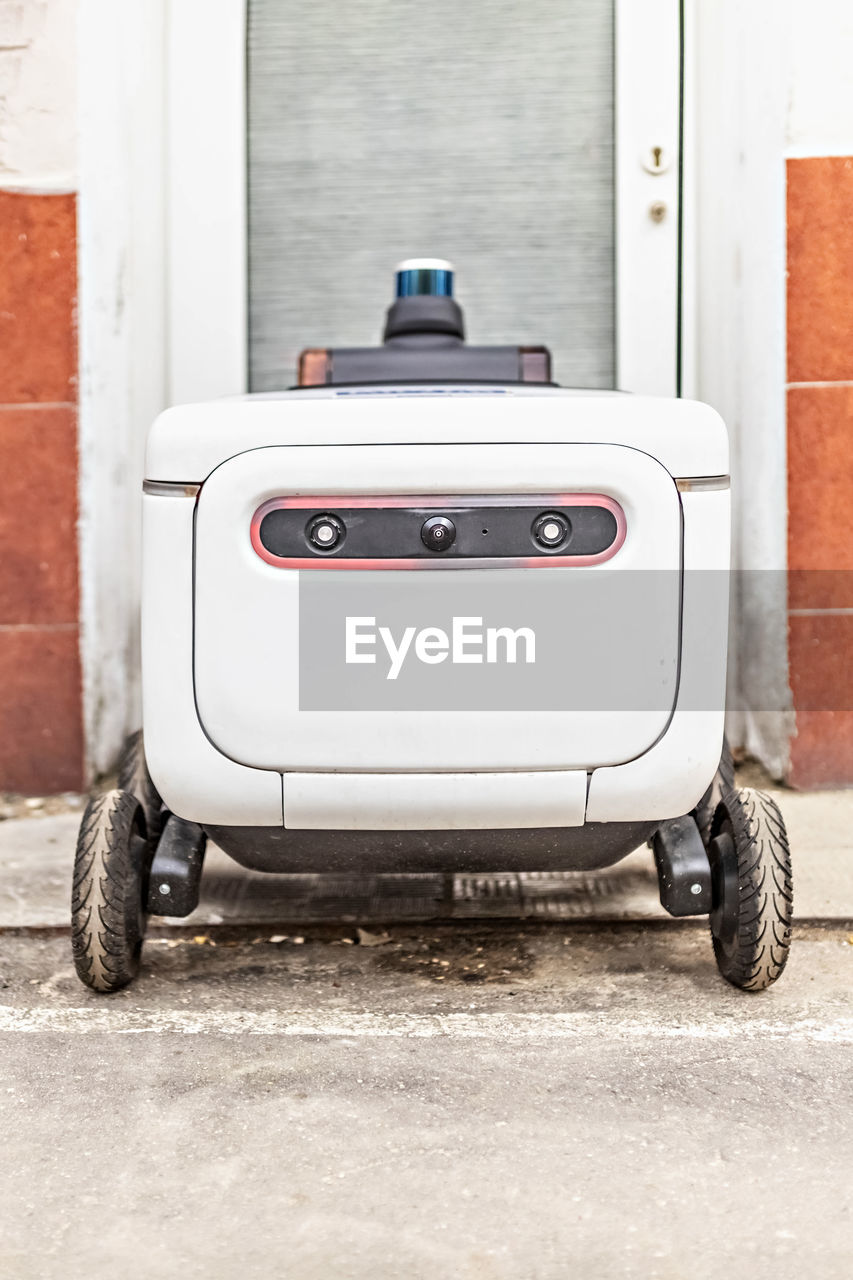 Automatic delivery robot for the transportation of goods and packages.futuristic robot electric car