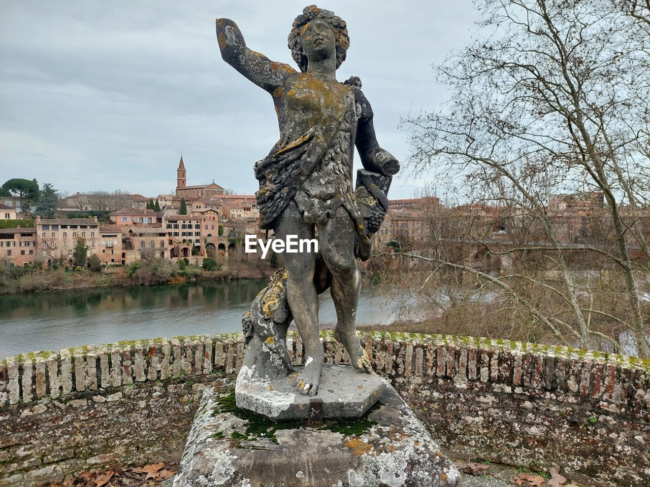 Low angle view of statue against sky