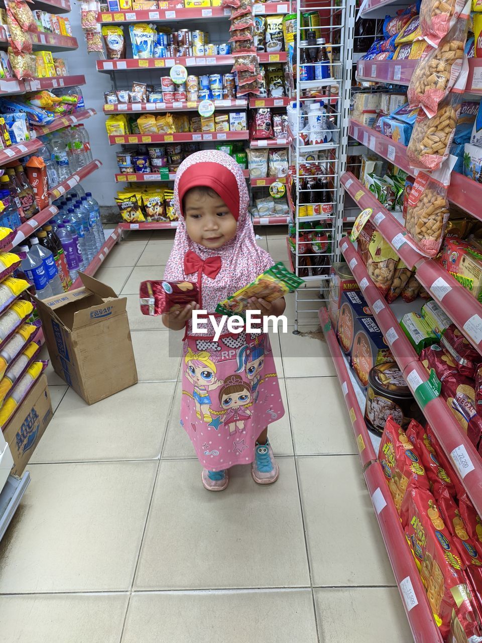 LOW ANGLE VIEW OF GIRL HAVING STORE