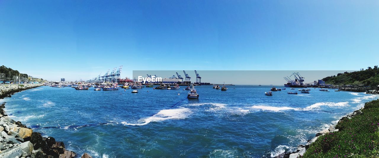 Scenic view of sea against clear blue sky