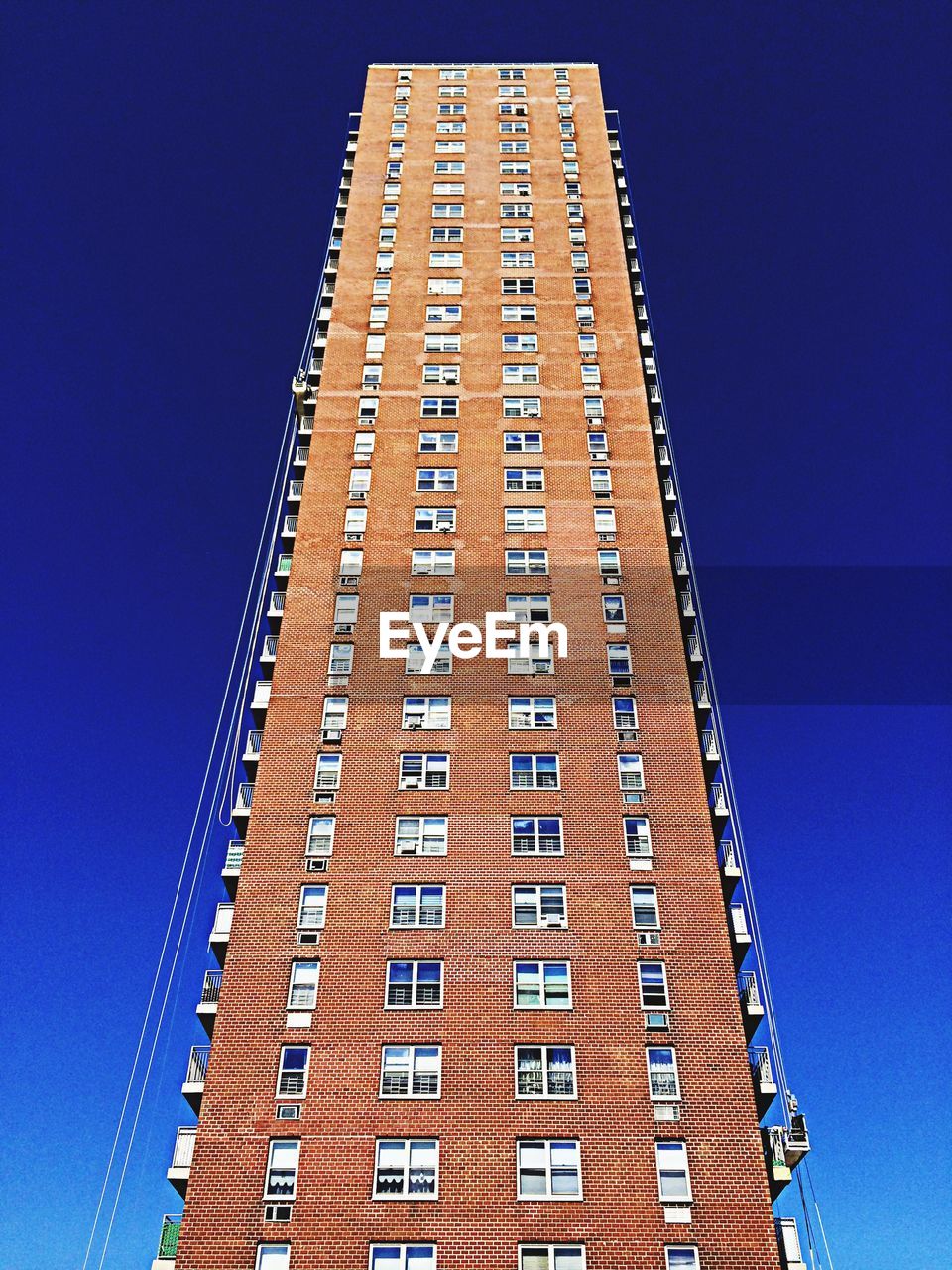 Low angle view of bay ridge tower against clear blue sky