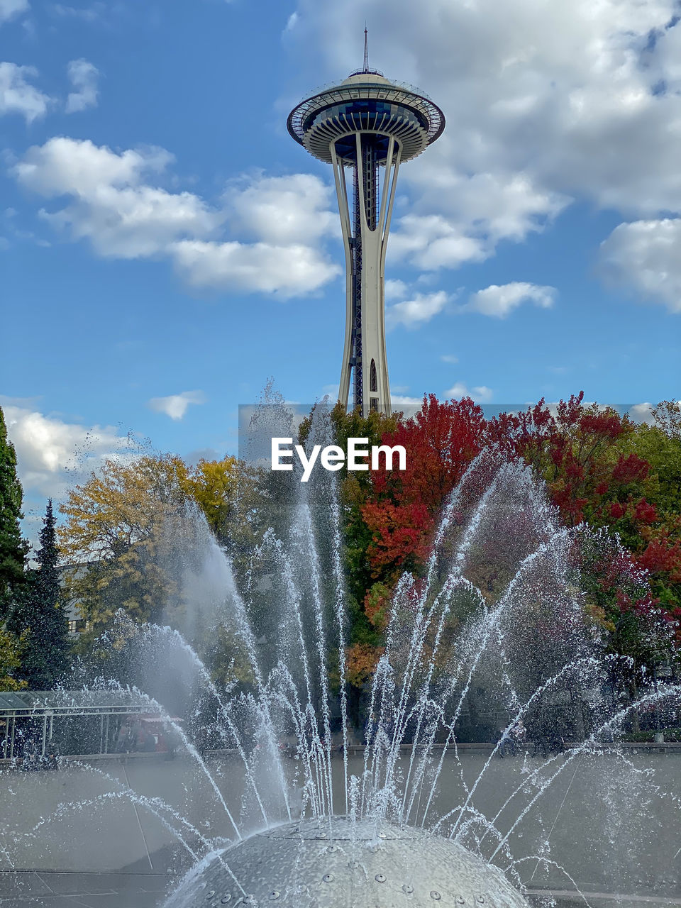 FOUNTAIN BY TREES AGAINST SKY