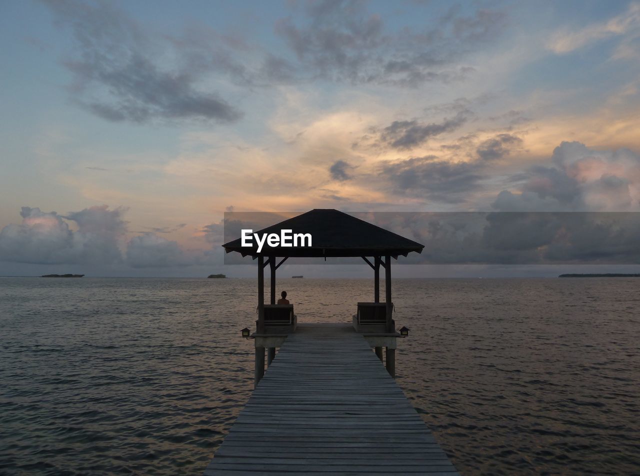 Empty pier at sunset