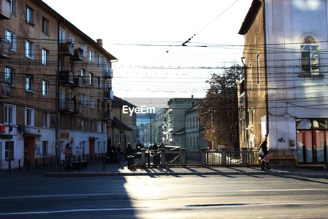 SURFACE LEVEL OF STREET AMIDST BUILDINGS IN CITY