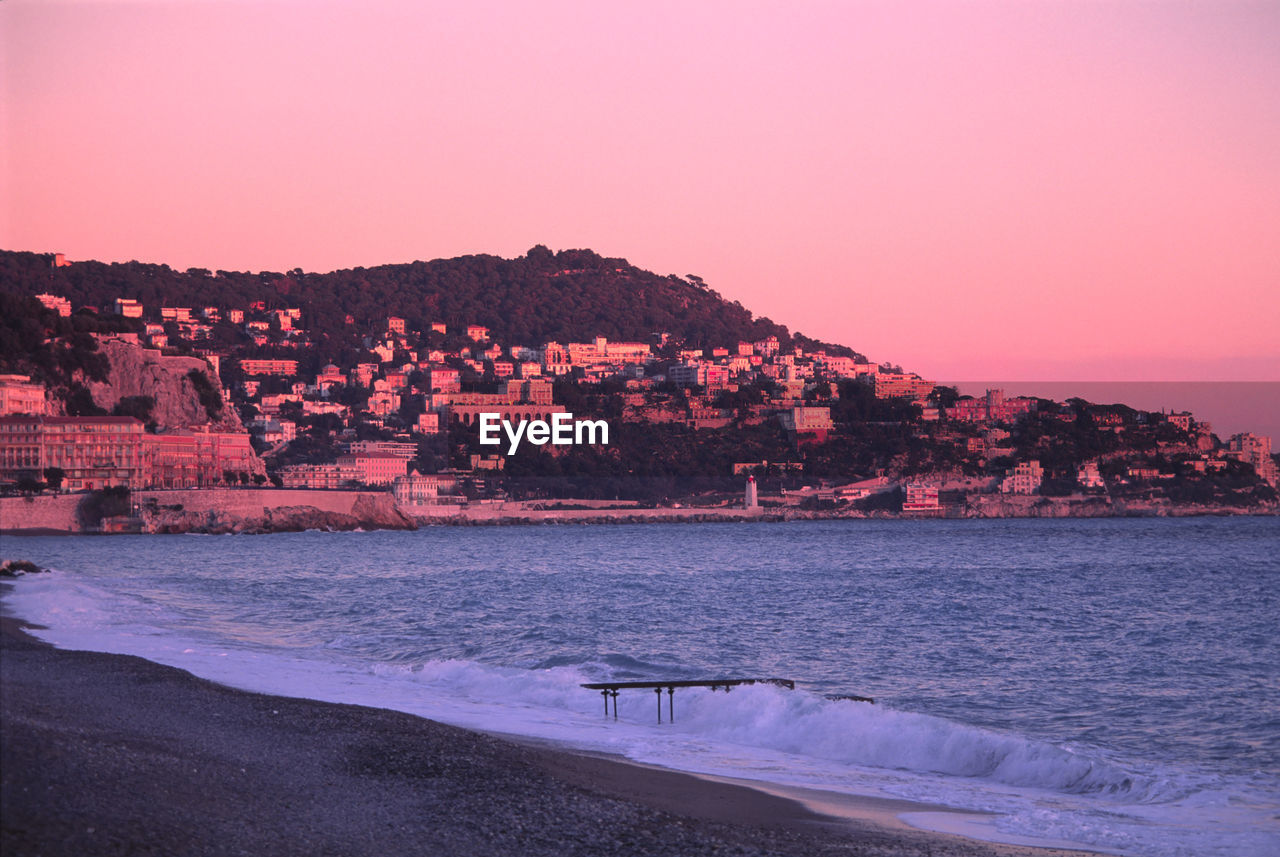 Scenic view of sea against clear sky during sunset