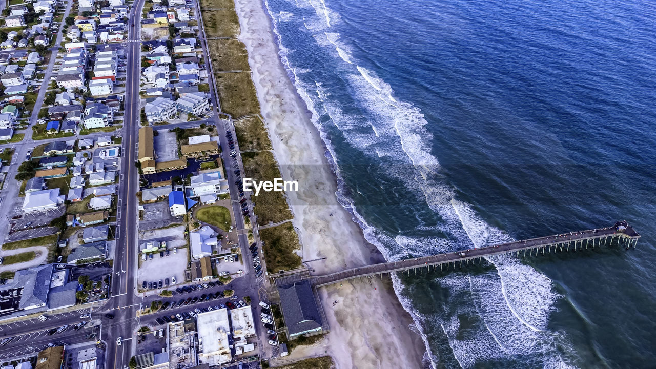 HIGH ANGLE VIEW OF SEA SEEN THROUGH CAR