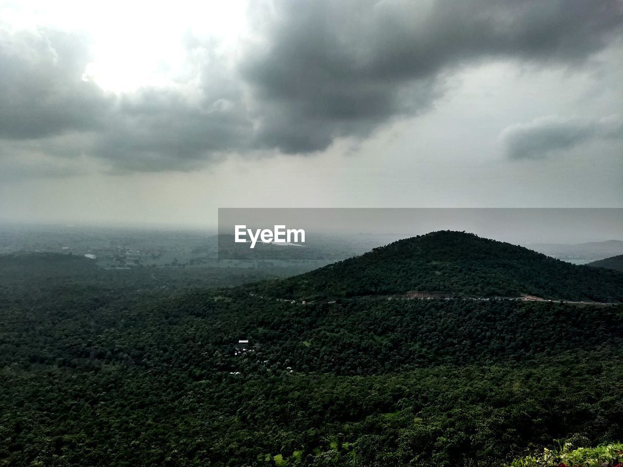 SCENIC VIEW OF MOUNTAINS AGAINST SKY DURING RAINY SEASON