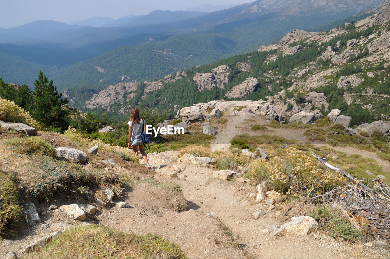 Rear view of woman looking at mountains