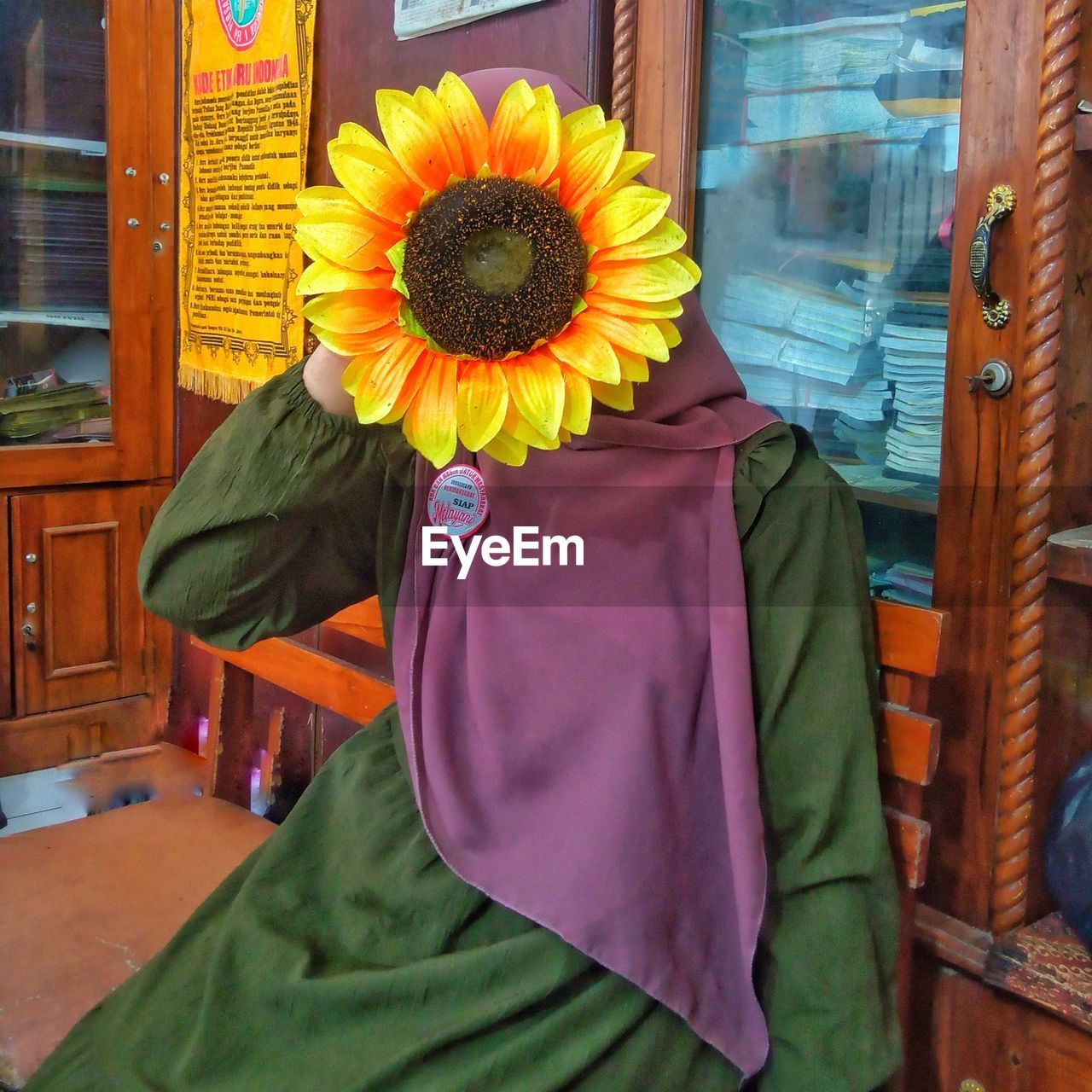 sunflower, flower, one person, yellow, flowering plant, clothing, plant, nature, adult, architecture, traditional clothing, outdoors