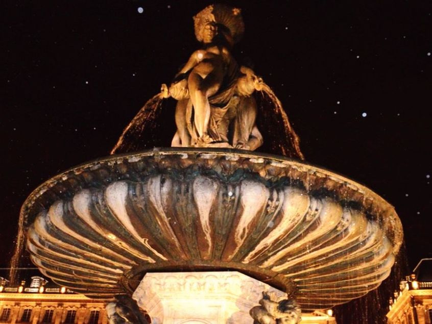 LOW ANGLE VIEW OF STATUE AT NIGHT