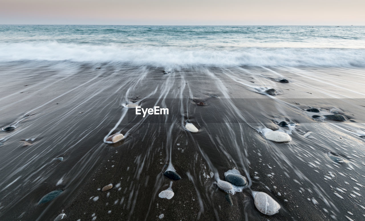 High angle view of snow on beach against sky