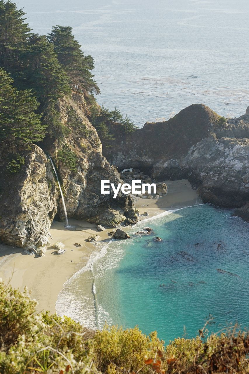 High angle view of mcway falls with blue ocean 