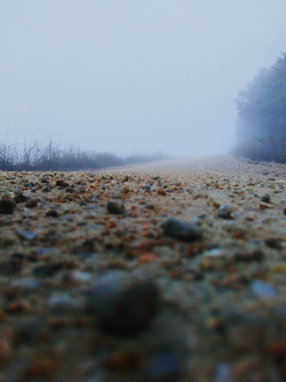 SURFACE LEVEL OF SAND AGAINST CLEAR SKY