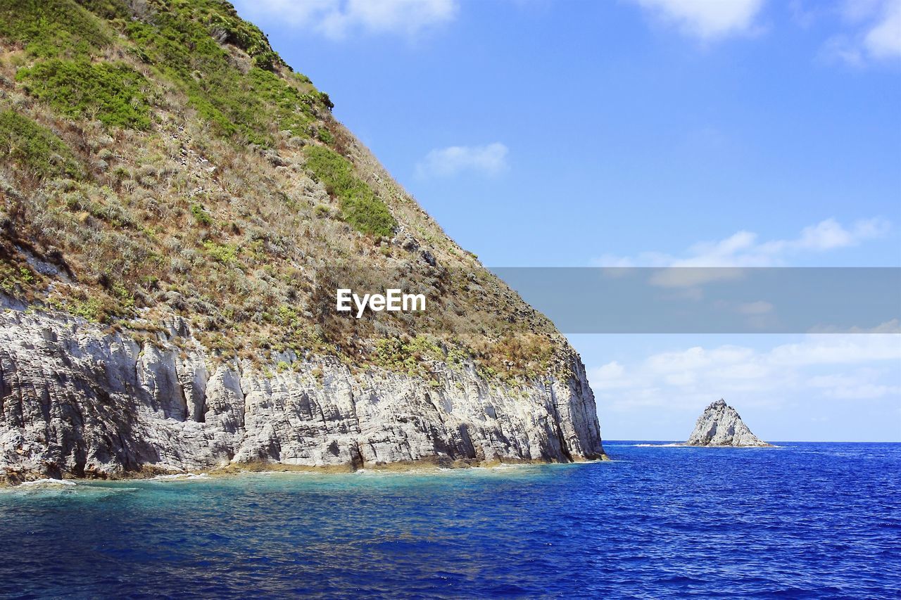 Scenic view of sea against cloudy sky