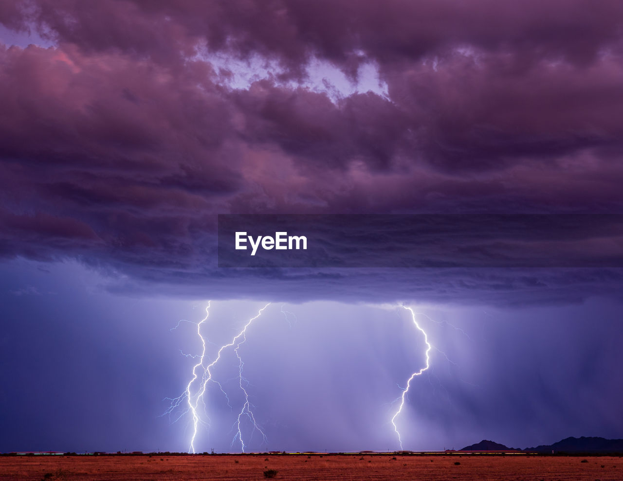 Multiple lightning strikes from a monsoon thunderstorm near phoenix, arizona