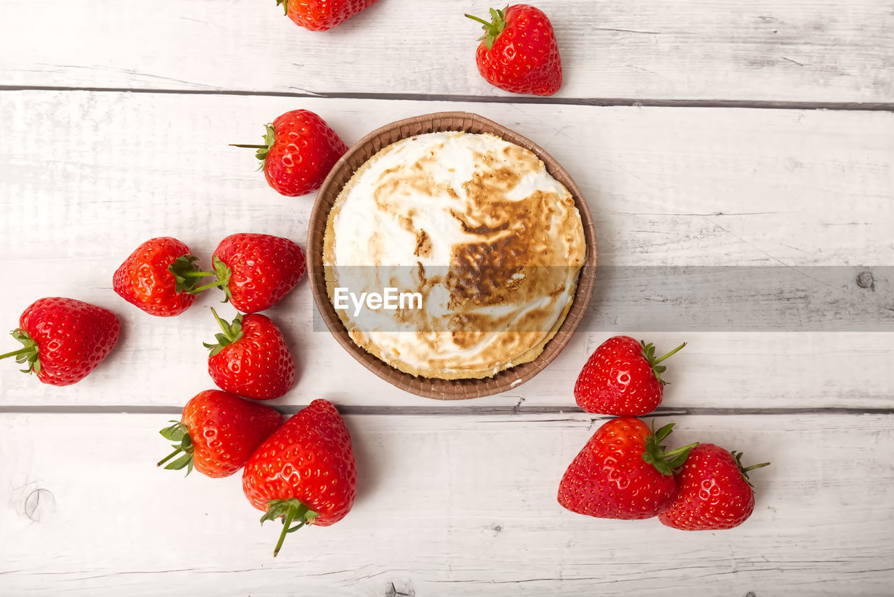 strawberry, food and drink, food, berry, healthy eating, fruit, freshness, wood, red, wellbeing, plant, dessert, studio shot, indoors, breakfast, produce, table, no people, sweet food, directly above, dairy, meal, bowl, high angle view, still life, dish, raspberry, rustic