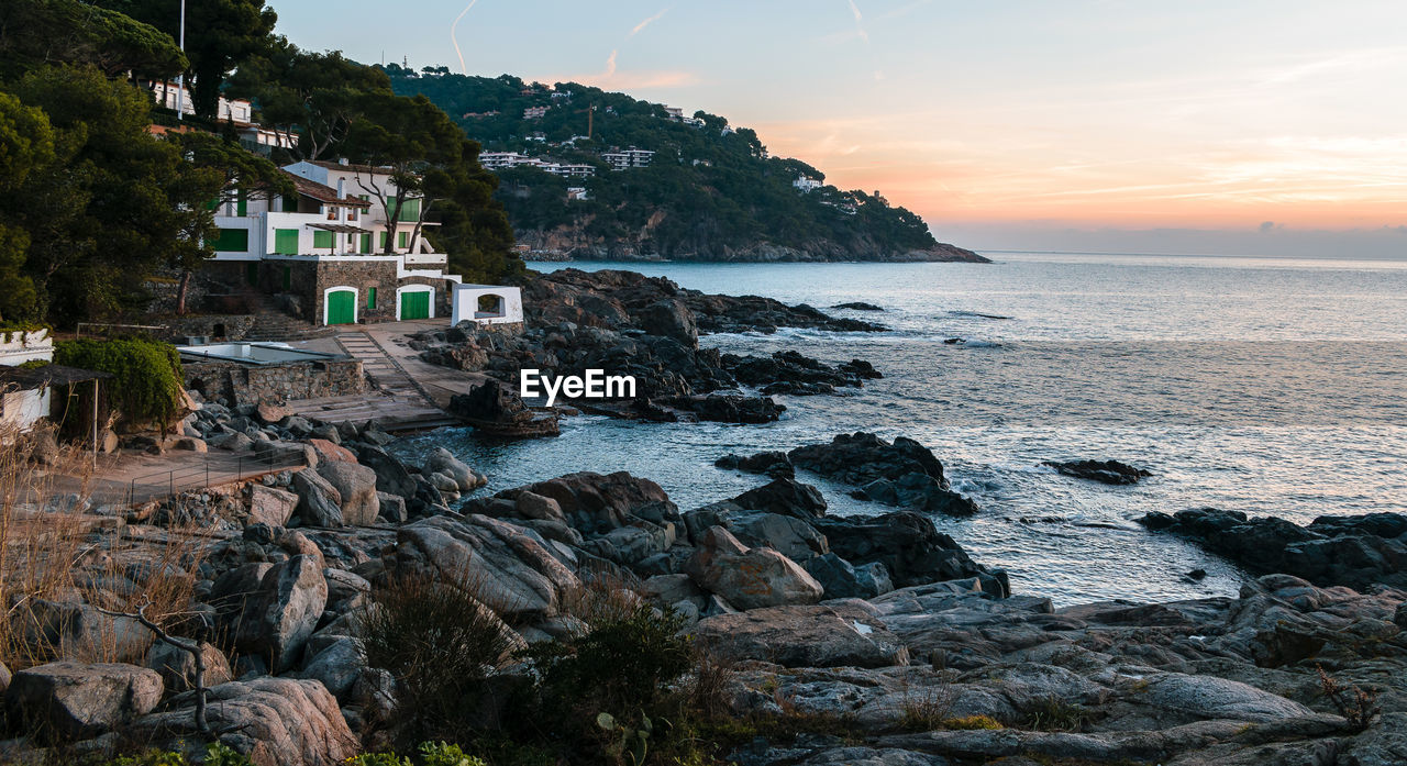 SCENIC VIEW OF SEA DURING SUNSET