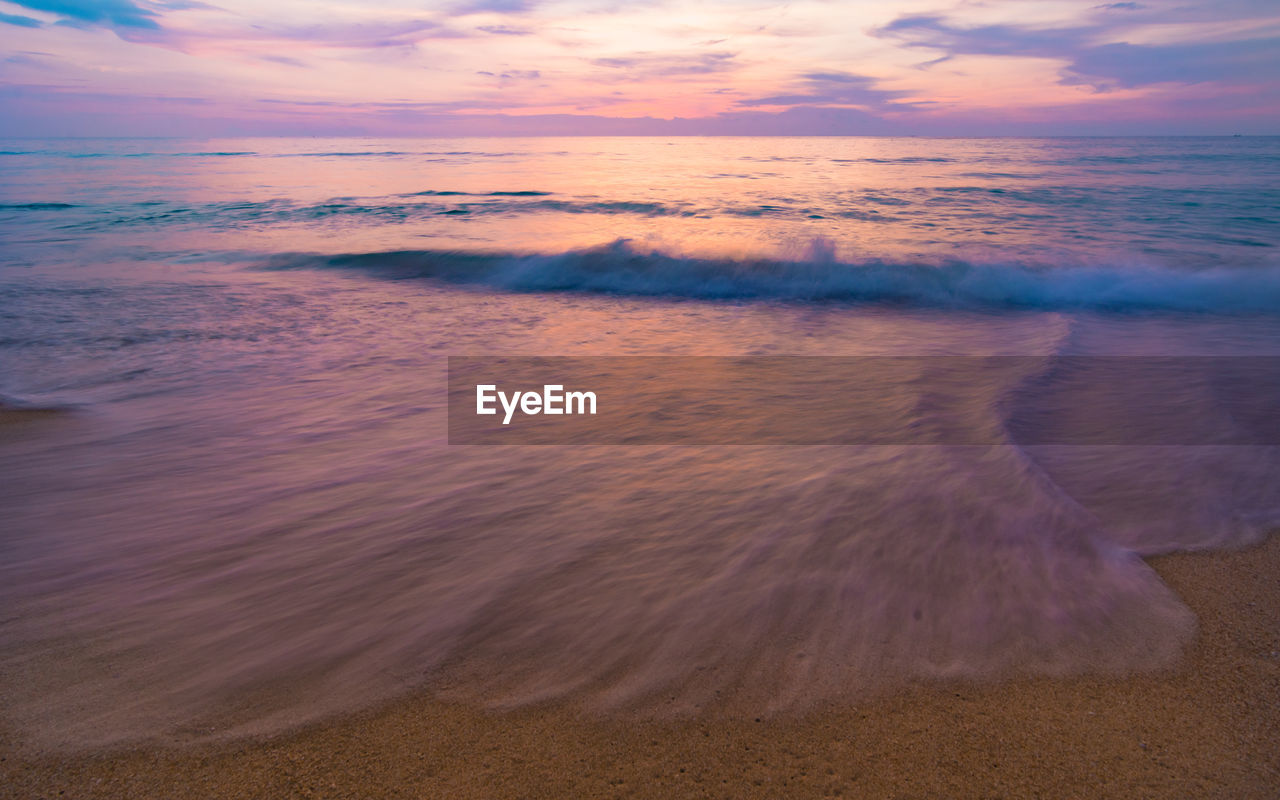 A colorful seascape with a vivid sky background