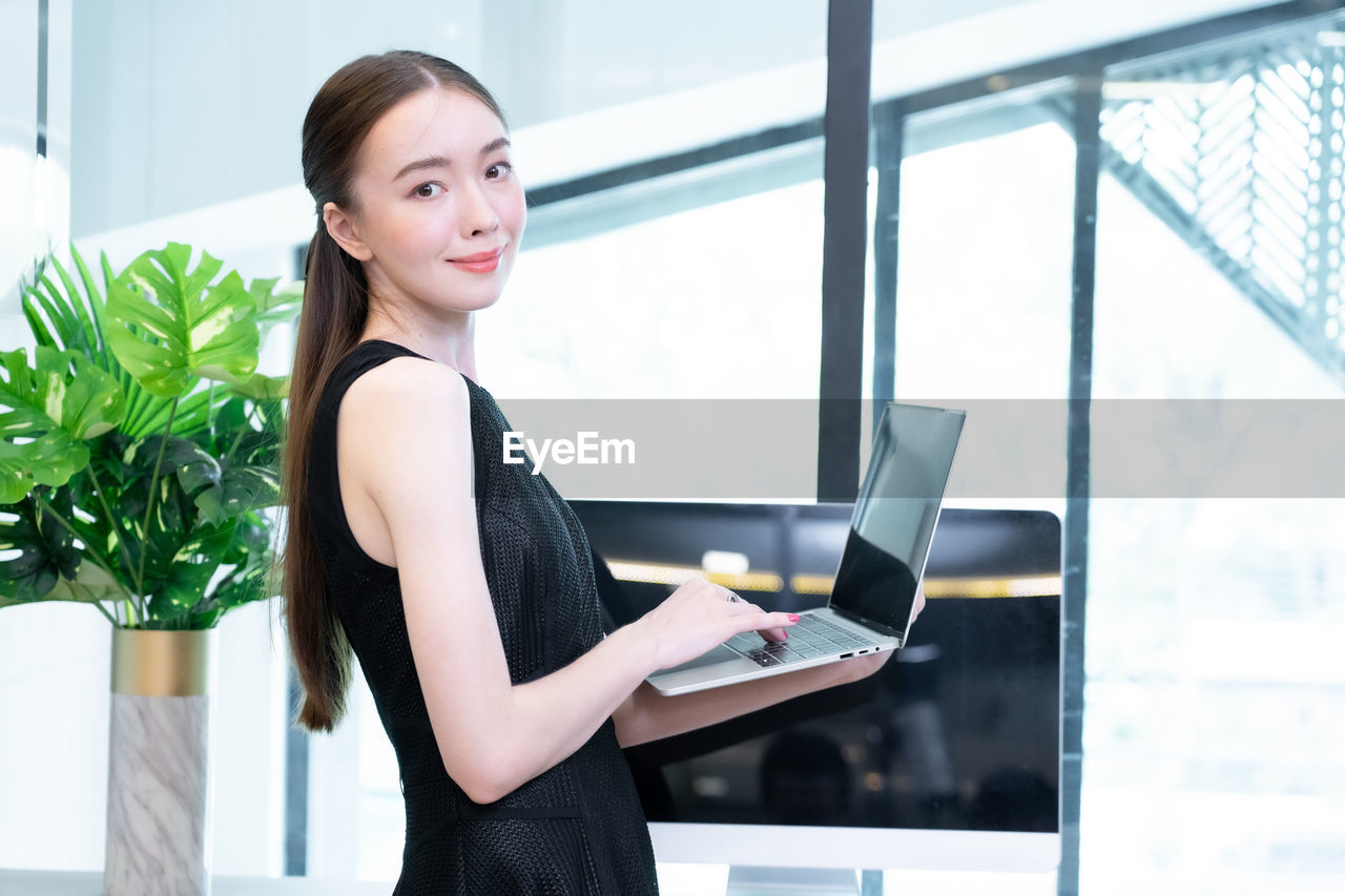 Young woman using mobile phone