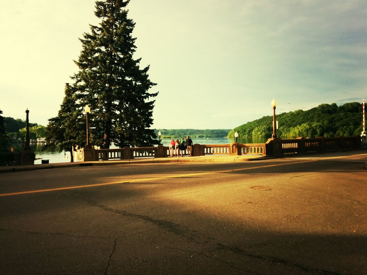 Mid distance view of people looking at river