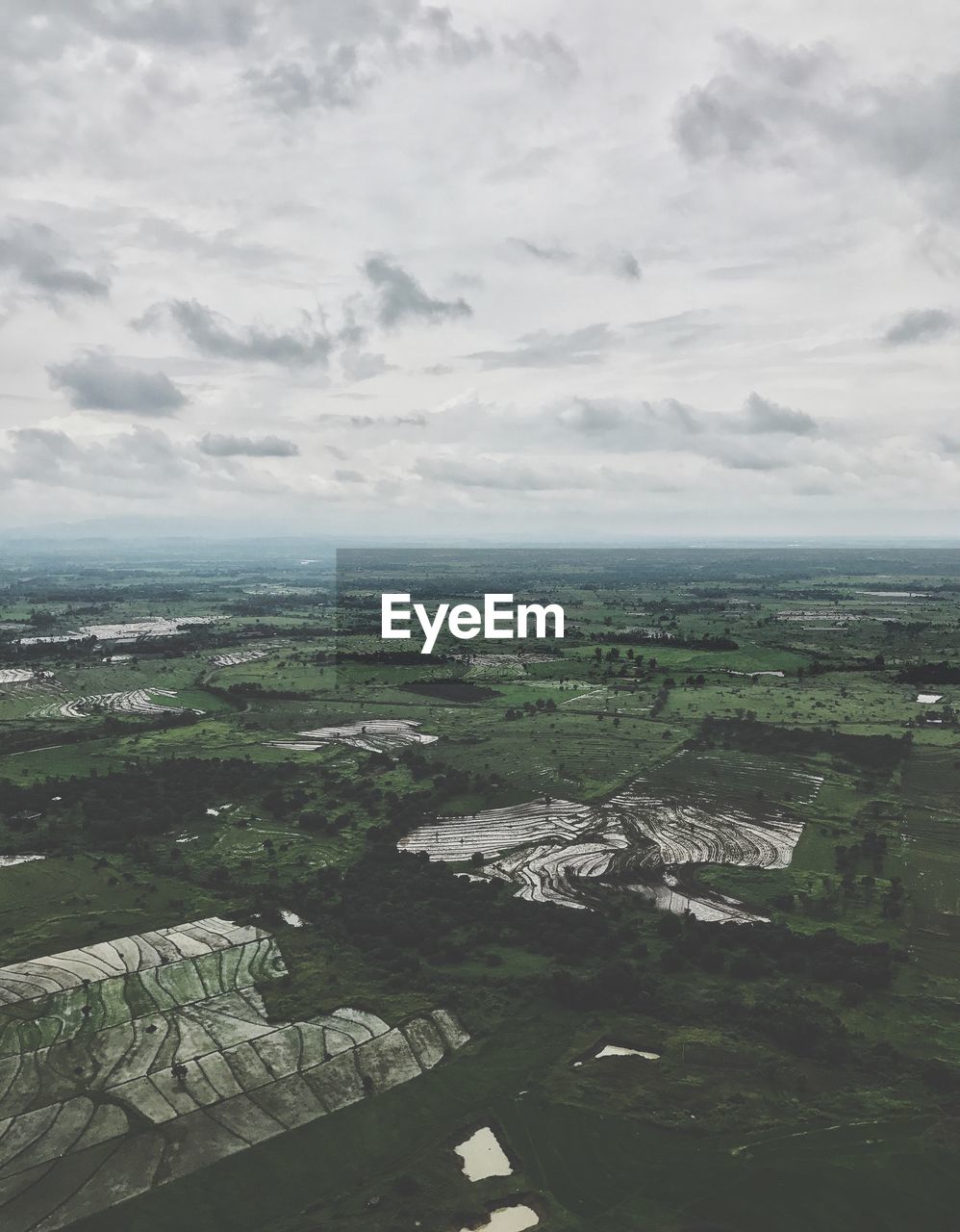 Aerial view of landscape and sea against sky