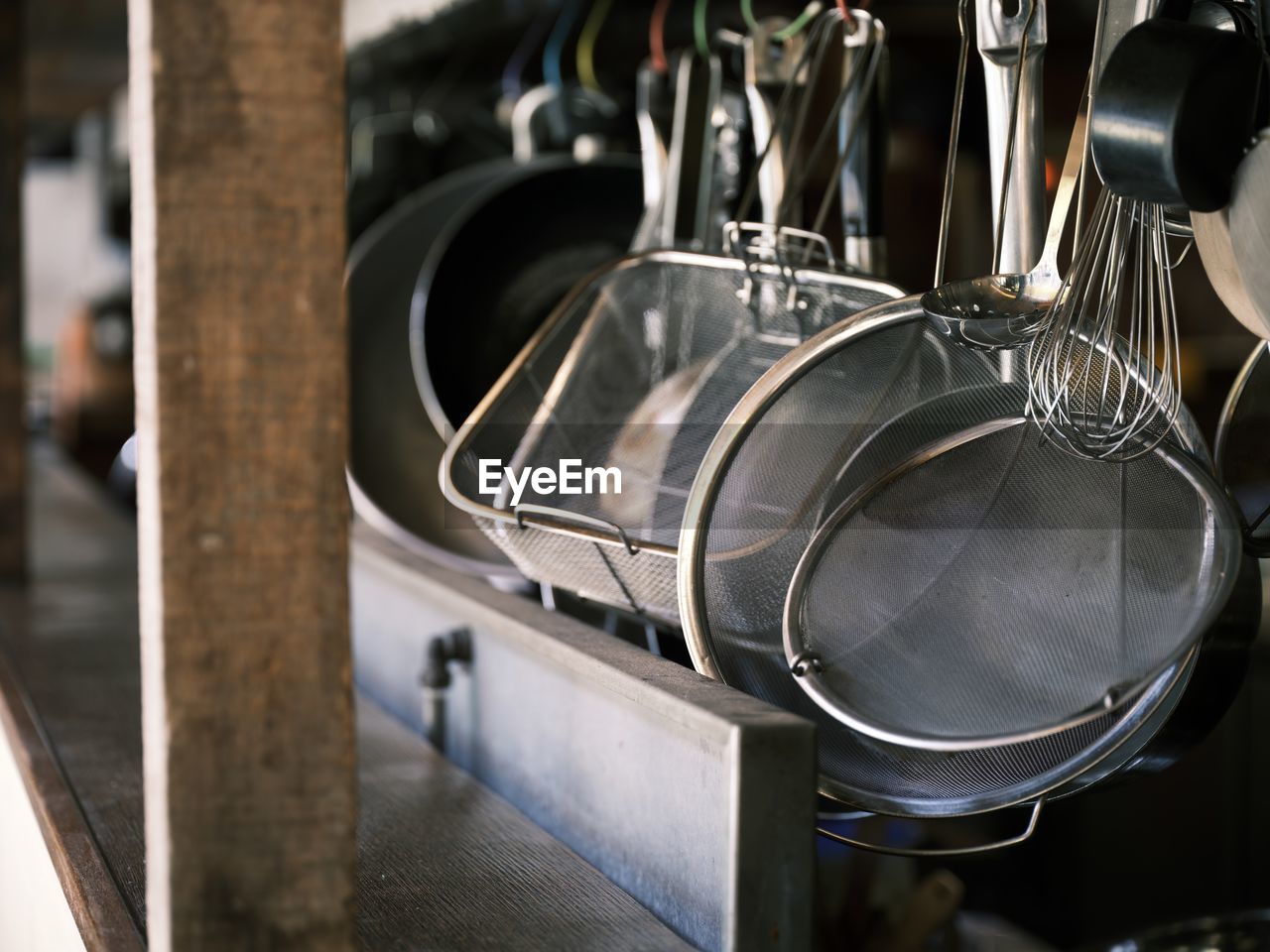 kitchen, household equipment, domestic room, kitchen utensil, metal, domestic kitchen, indoors, home, iron, no people, vehicle, steel, close-up, cooking pan, food and drink, stainless steel, focus on foreground, wheel, food and drink establishment, appliance