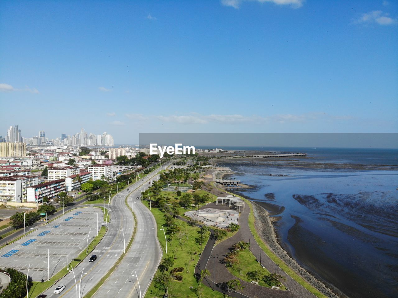 High angle view of sea and buildings against sky