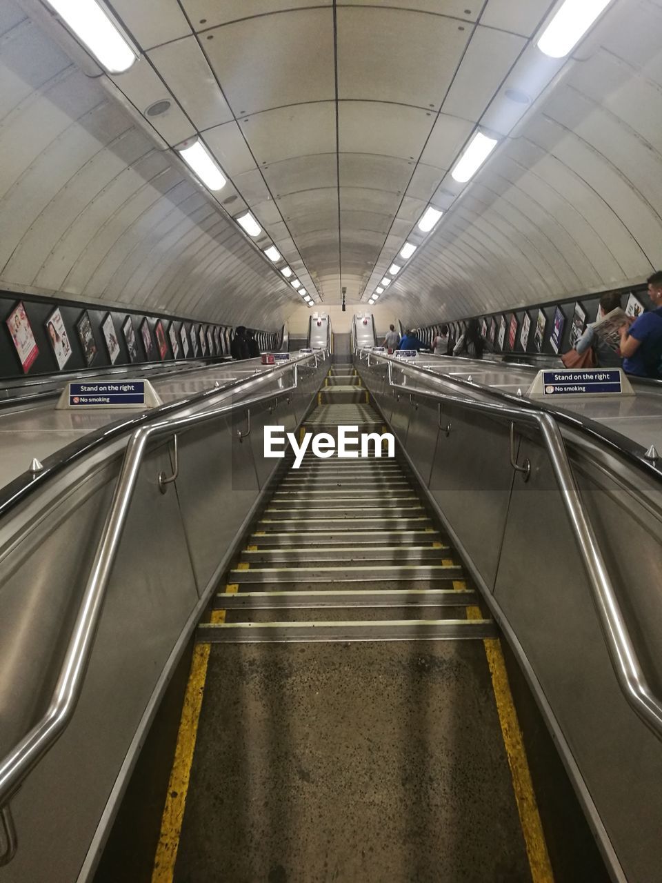 People on moving walkway at airport