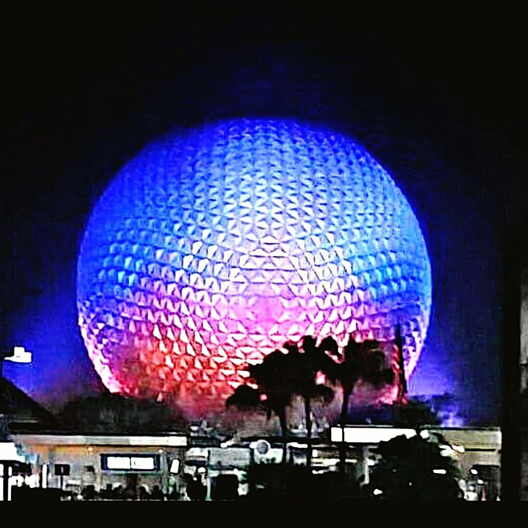 LOW ANGLE VIEW OF ILLUMINATED LIGHTS AT NIGHT