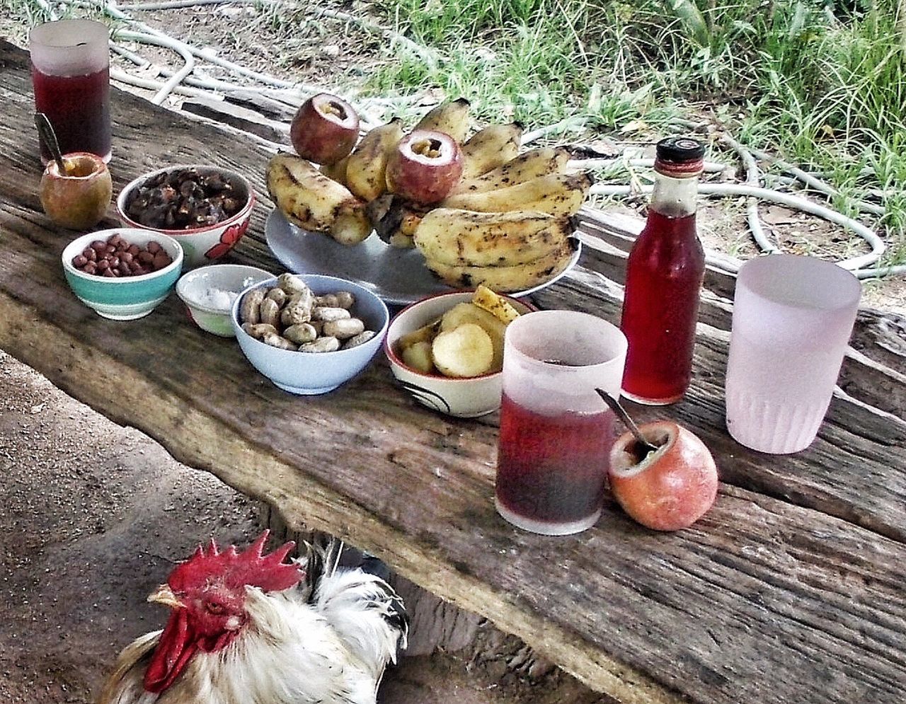 CLOSE-UP OF MUSHROOMS ON WOODEN TABLE