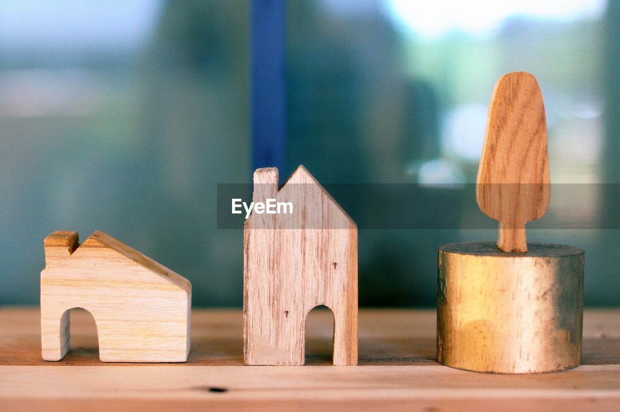 Close-up of wooden model houses on table