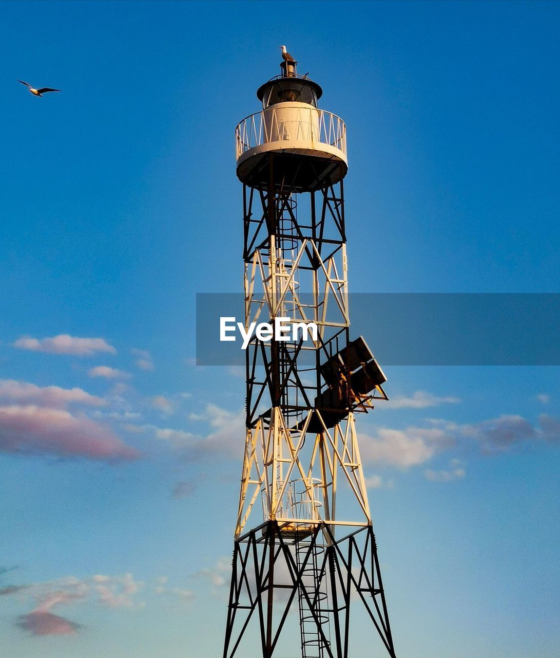 tower, sky, architecture, built structure, observation tower, lighthouse, nature, blue, cloud, observation point, no people, lookout tower, low angle view, technology, water tower, outdoors, security, day, building exterior, protection, communications tower, water tower - storage tank, surveillance