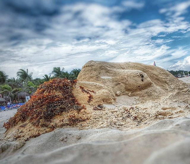 SCENIC VIEW OF ROCK FORMATION AGAINST CLOUDY SKY