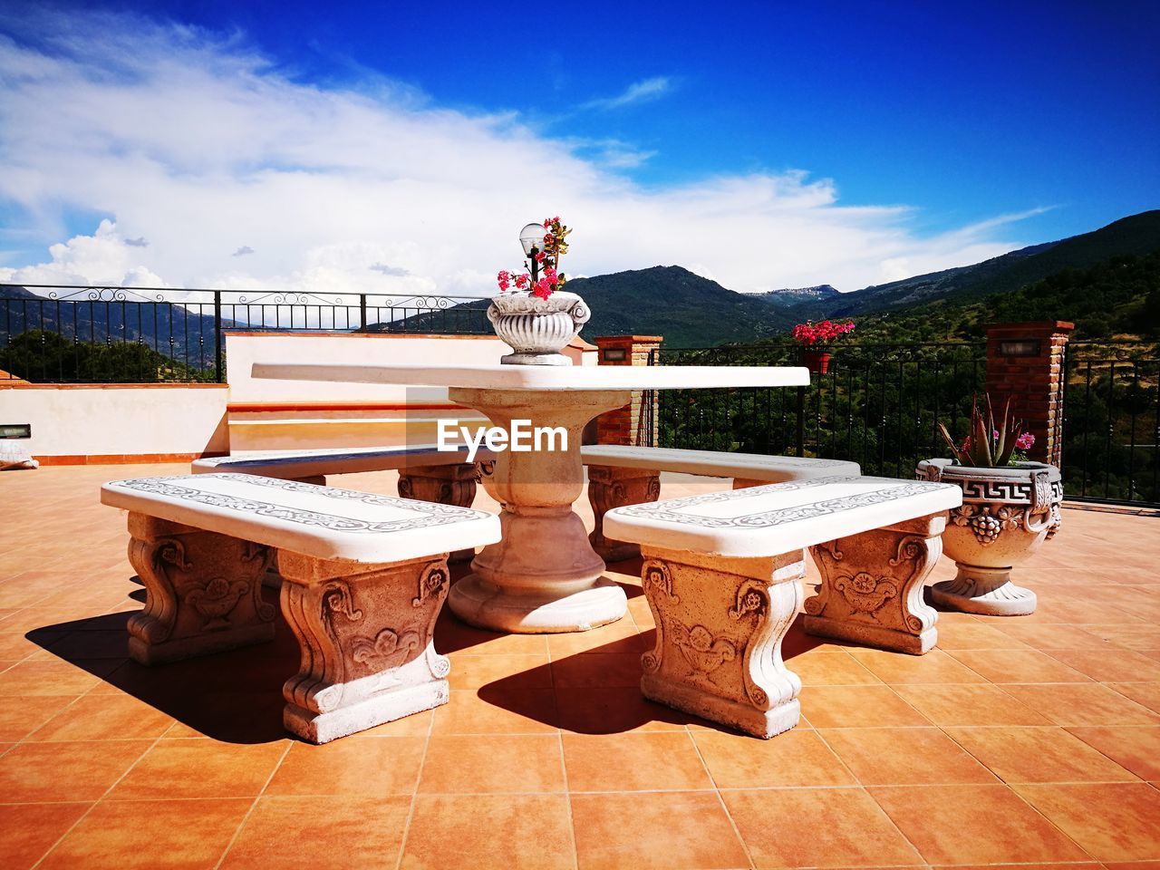 STATUE ON TABLE AGAINST CLEAR SKY