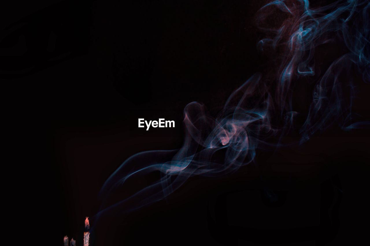 Close-up of smoke against black background