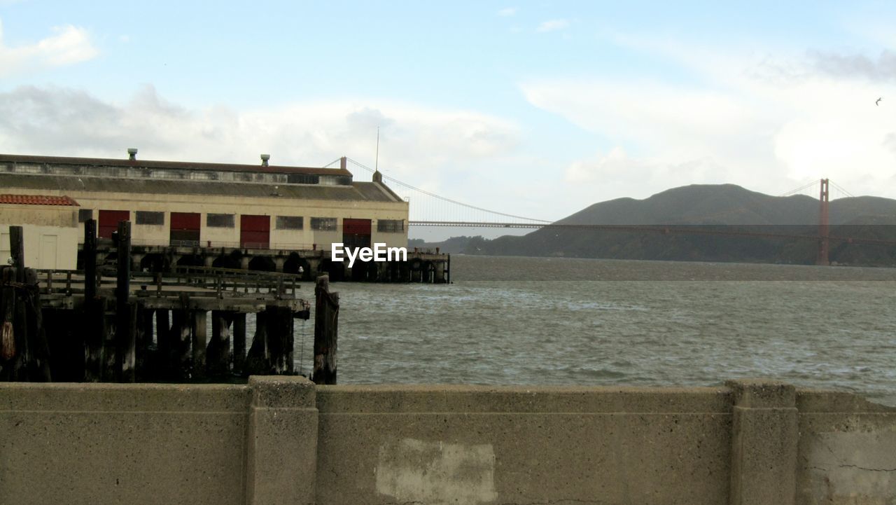 BUILT STRUCTURE ON SEA AGAINST SKY