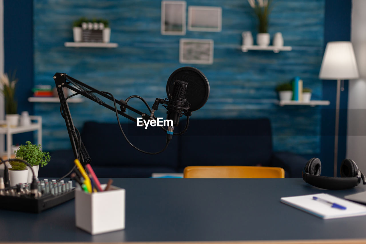 Podcasting microphone on table in studio